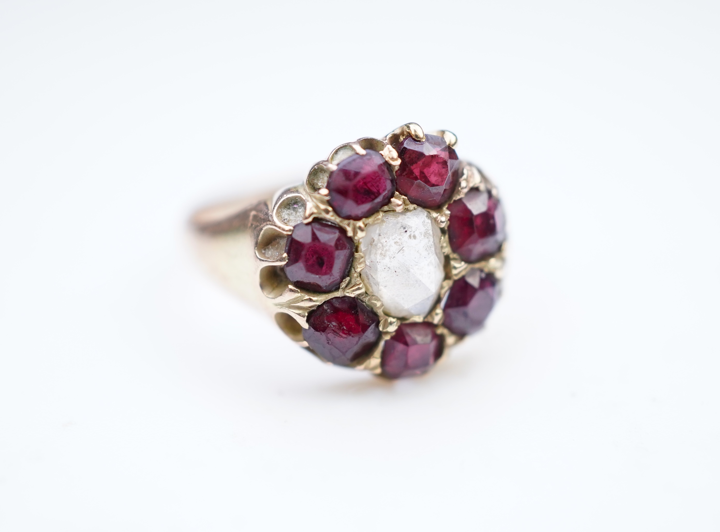 A garnet and diamond ring, late 19th century